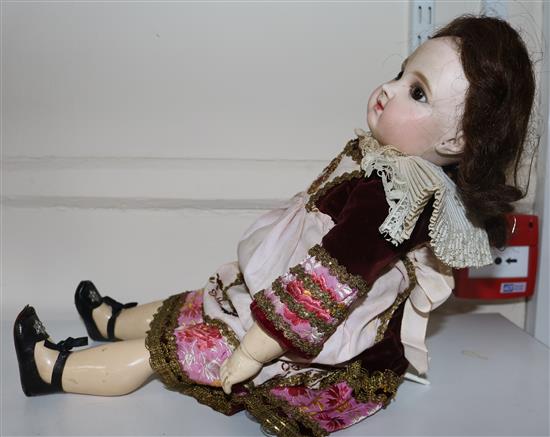A Jumeau bisque head doll, stamped 7EJ, late 19th century, height 17.5in., small firing crack to right ear